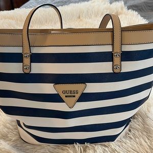 Guess blue and white shoulder bag with tan trim like new with no scuffs or marks